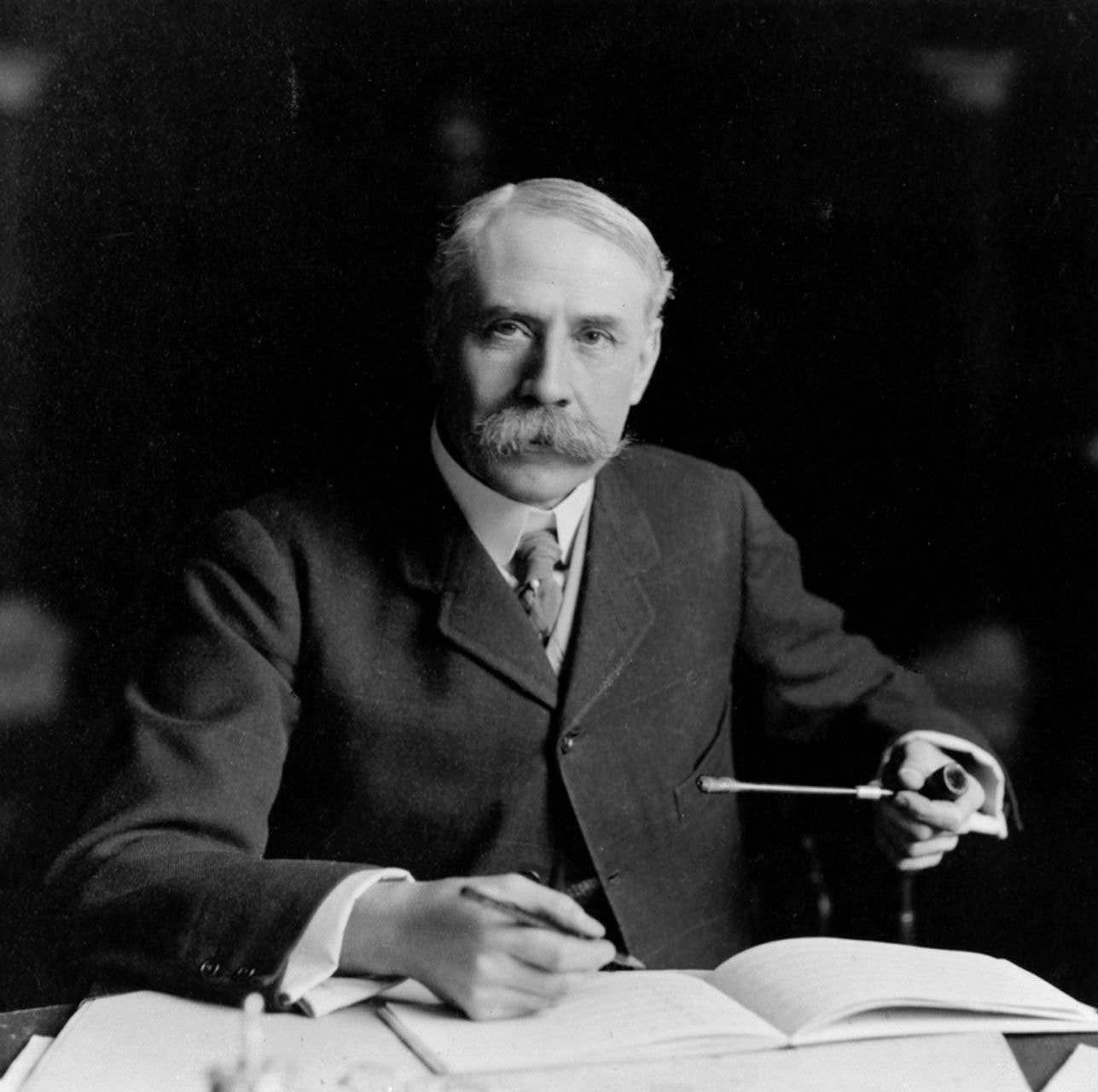 Sir Edward Elgar at a desk