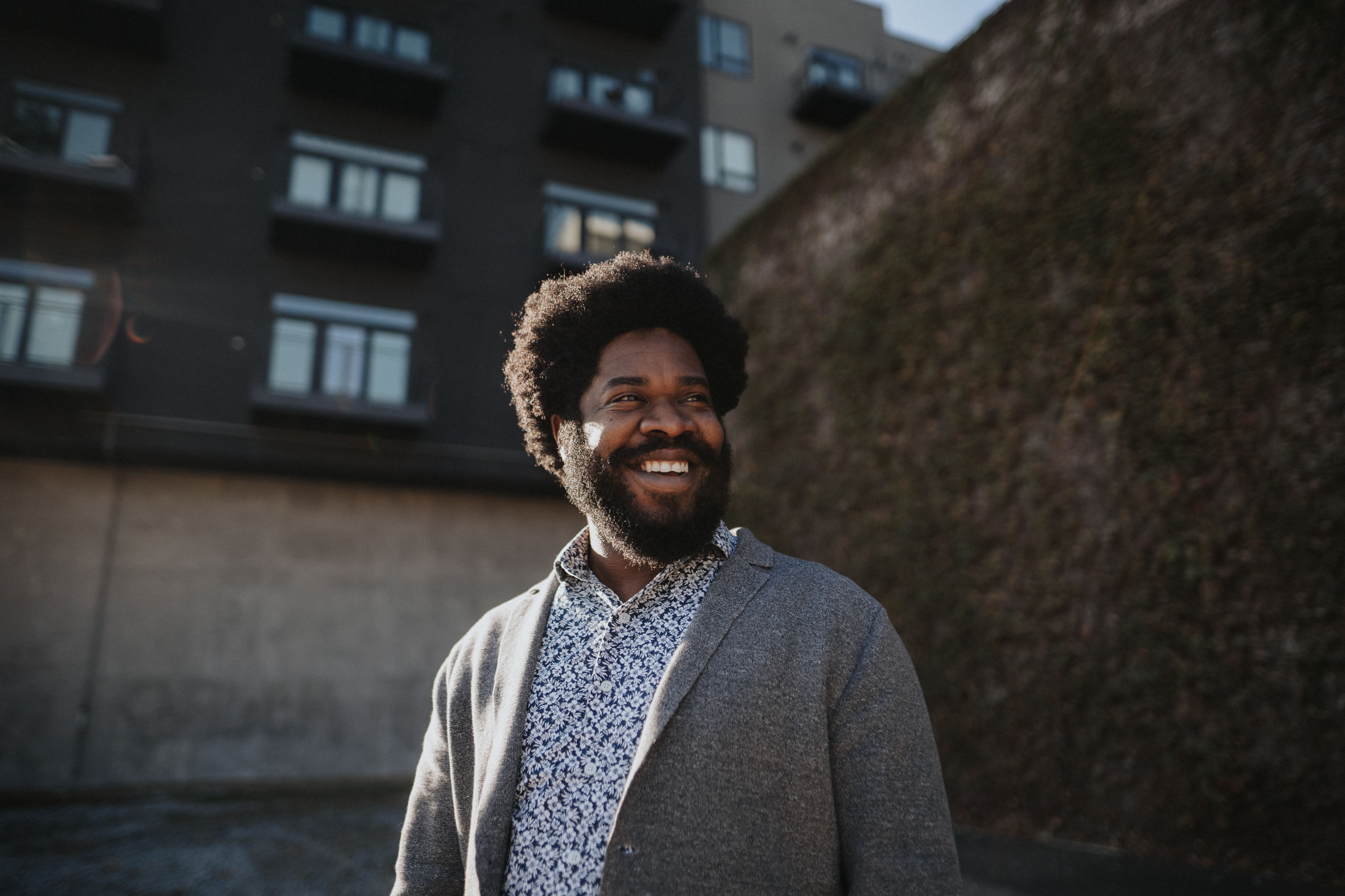 Dasha Burton standing near brick wall